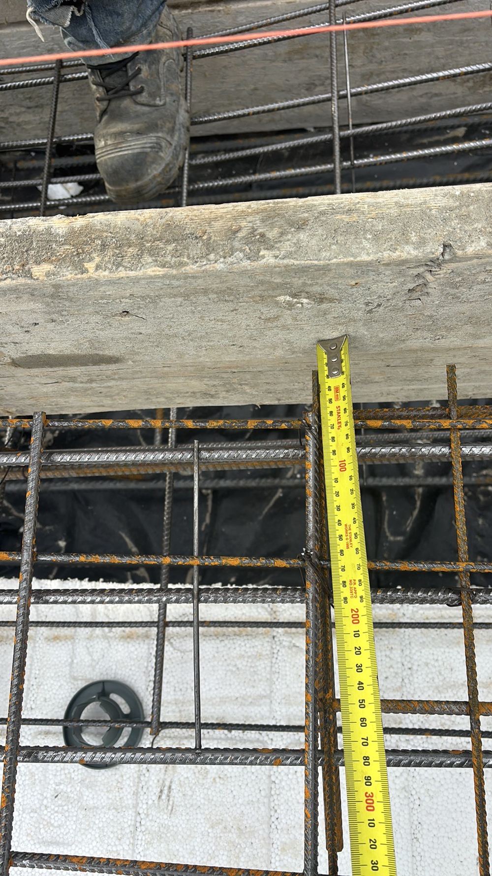 Insufficient concrete cover to footing reinforcement, recorded on a pre-pour inspection in Fraser Rise