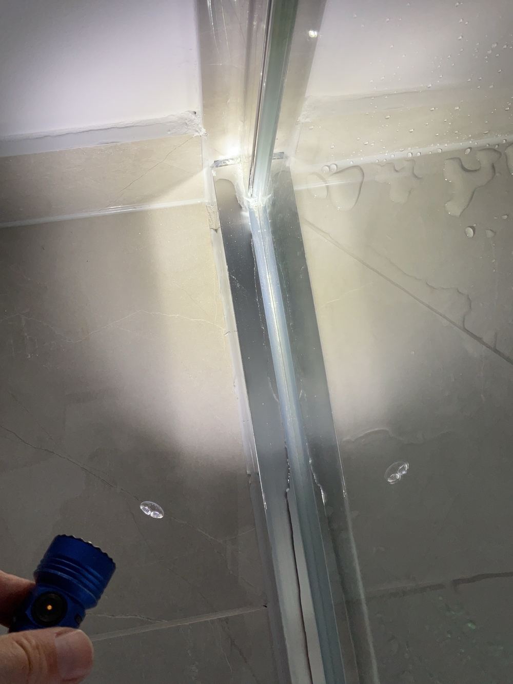 Shower leaking at its corners, recorded on a pre-handover inspection in Fraser Rise