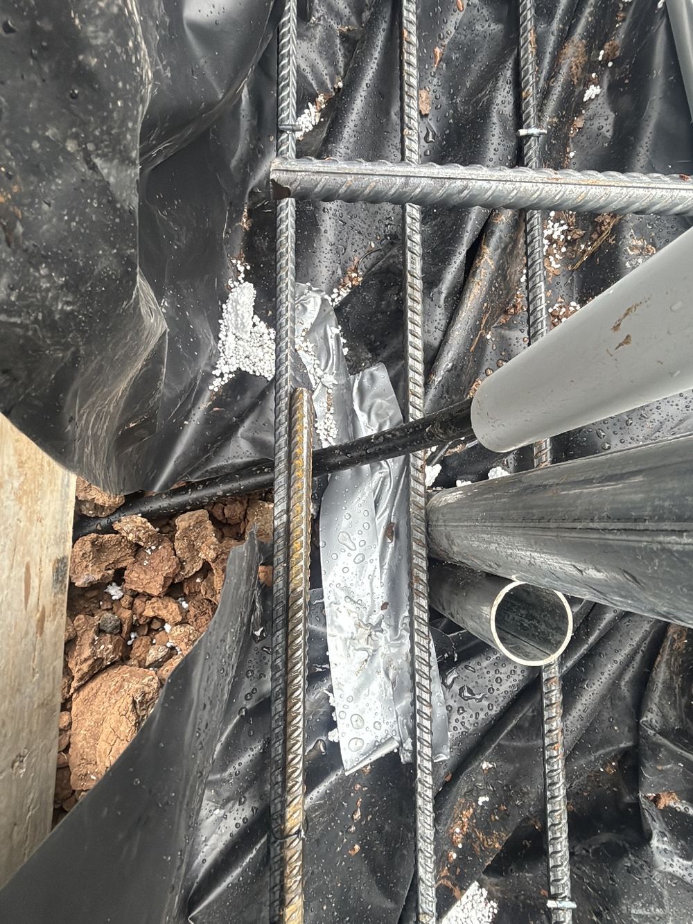 Barrier punctures not sealed, recorded on a slab pre-pour inspection in Fraser Rise